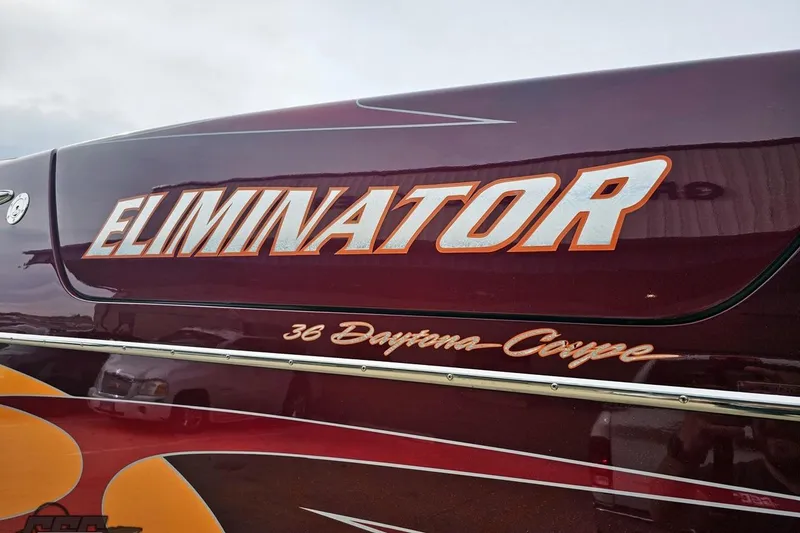Slide: The Image of 2008 Eliminator 36 Daytona Coupe boat with bold lettering and sleek design. - 35