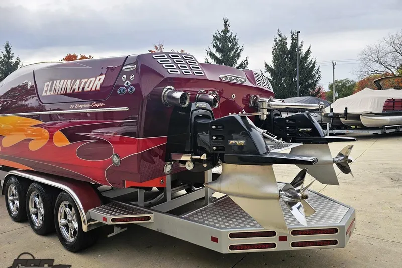 Slide: The Image of 2008 Eliminator 36 Daytona Coupe boat with vibrant graphics and dual Mercury engines. - 37