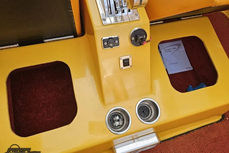Slide: The Image of 2008 Eliminator 36 Daytona Coupe interior with yellow console and red carpet. - 57