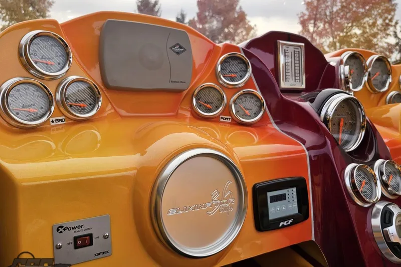 Slide: The Image of Dashboard of a 2008 Eliminator 36 Daytona Coupe with vibrant gauges and controls. - 59