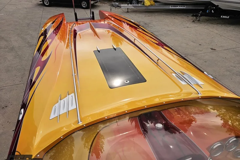 Slide: The Image of 2008 Eliminator 36 Daytona Coupe with vibrant custom paint and sleek design. - 62