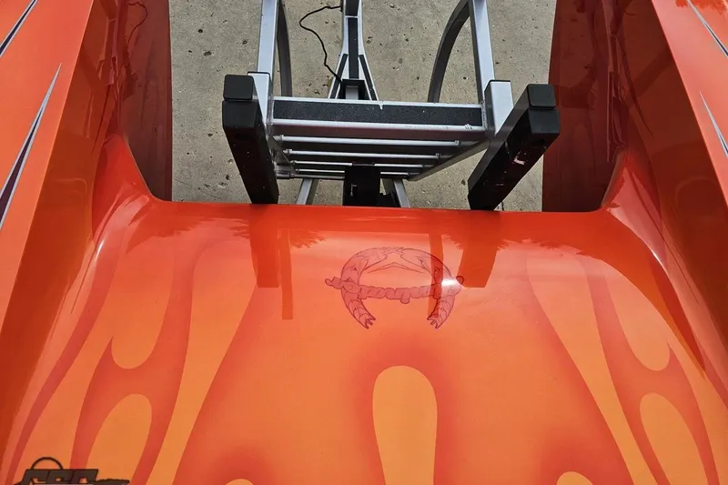 Slide: The Image of Orange 2008 Eliminator 36 Daytona Coupe with flame design and crab graphic. - 69