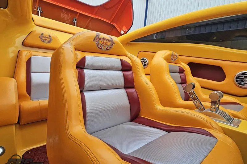 Slide: The Image of 2008 Eliminator 36 Daytona Coupe interior with vibrant yellow and red seating. - 71