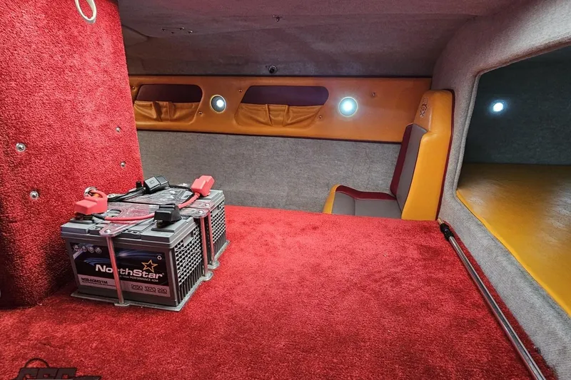Slide: The Image of Interior of 2008 Eliminator 36 Daytona Coupe with red carpet and NorthStar battery. - 78