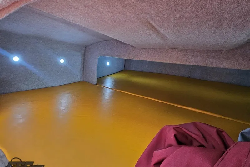 Slide: The Image of Interior cabin of 2008 Eliminator 36 Daytona Coupe with yellow flooring and ambient lighting. - 79