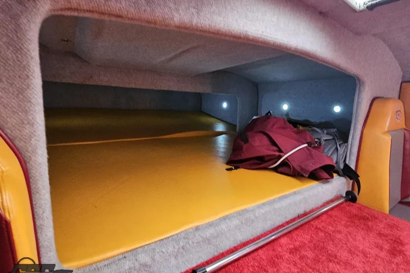 Slide: The Image of Interior cabin of 2008 Eliminator 36 Daytona Coupe with yellow and red upholstery. - 81