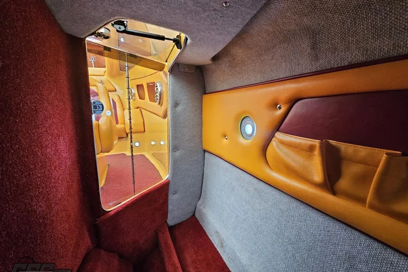 Slide: The Image of 2008 Eliminator 36 Daytona Coupe interior with vibrant upholstery and sleek design elements. - 85