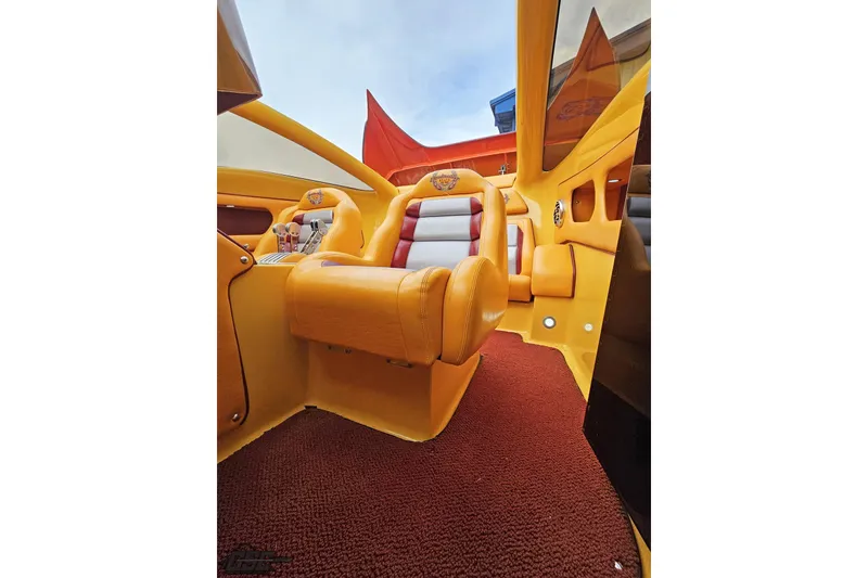 Slide: The Image of Luxurious interior of 2008 Eliminator 36 Daytona Coupe with vibrant yellow and red seating. - 86