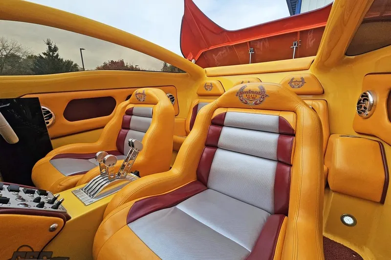 Slide: The Image of 2008 Eliminator 36 Daytona Coupe interior with vibrant yellow and red leather seats. - 87
