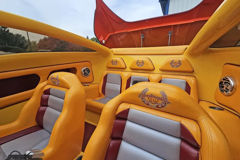 Slide: The Image of Luxurious interior of a 2008 Eliminator 36 Daytona Coupe with vibrant yellow and red seating. - 88