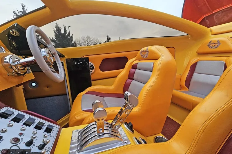 Slide: The Image of 2008 Eliminator 36 Daytona Coupe interior with vibrant yellow and red leather seats. - 89