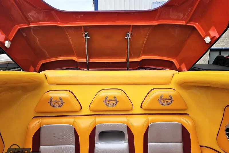 Slide: The Image of 2008 Eliminator 36 Daytona Coupe interior with vibrant yellow and orange upholstery. - 93