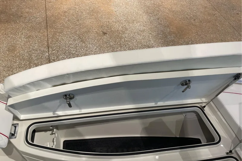 Slide: The Image of Open storage compartment on 2026 Ranger 2510 Bay boat, showcasing interior space. - 12