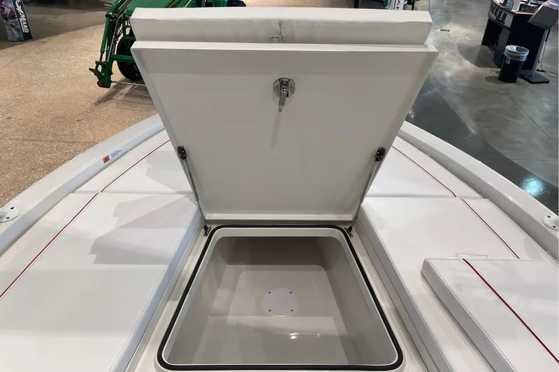 Slide: The Image of Open storage compartment on 2026 Ranger 2510 Bay boat deck. - 14