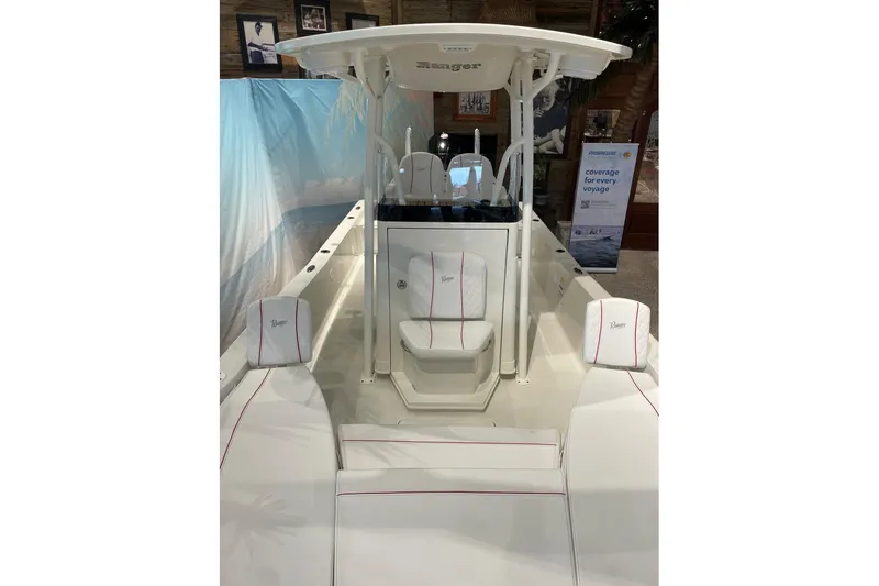 Slide: The Image of 2026 Ranger 2510 Bay boat interior with white seating and console. - 3