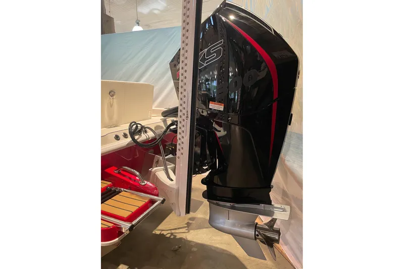 Slide: The Image of 2026 Ranger 2510 Bay boat with powerful outboard motor in showroom. - 4