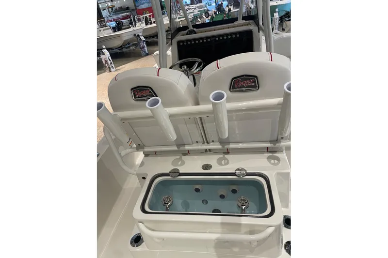 Slide: The Image of 2026 Ranger 2510 Bay boat interior with rod holders and livewell. - 6
