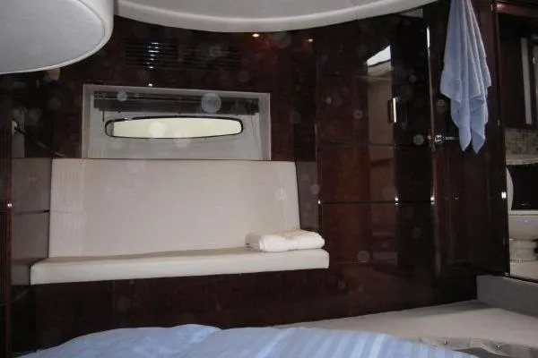 Slide: The Image of Interior of 2008 Sea Ray 47 Sedan Bridge yacht with elegant seating and window view. - 12