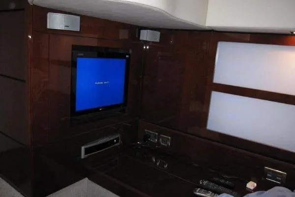 Slide: The Image of Interior of 2008 Sea Ray 47 Sedan Bridge with TV and entertainment system. - 13