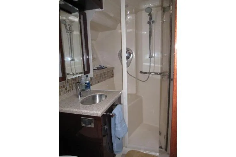 Slide: The Image of Luxurious bathroom in 2008 Sea Ray 47 Sedan Bridge yacht with shower and sink. - 14