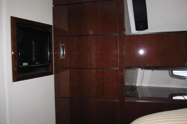 Slide: The Image of Luxurious interior of 2008 Sea Ray 47 Sedan Bridge with sleek wood cabinetry. - 15