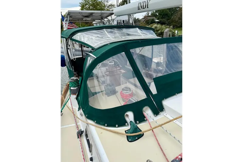 Slide: The Image of 1981 Bristol 45.5 Aft Cockpit sailboat with green canopy and clear windows. - 10