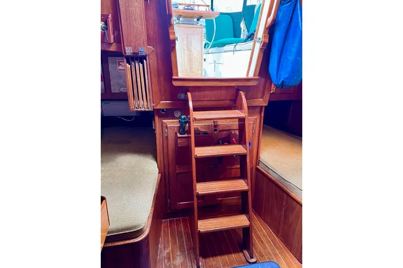 Slide: The Image of Interior of 1981 Bristol 45.5 Aft Cockpit sailboat with wooden steps and seating. - 17