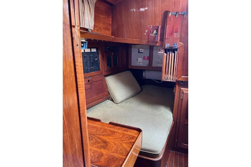 Slide: The Image of 1981 Bristol 45.5 Aft Cockpit interior with wood paneling and cozy seating area. - 19