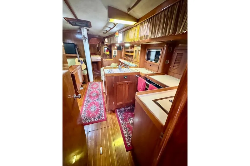 Slide: The Image of Interior of 1981 Bristol 45.5 Aft Cockpit yacht with wood finish and cozy decor. - 23