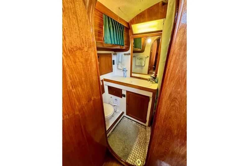 Slide: The Image of Interior of 1981 Bristol 45.5 Aft Cockpit yacht bathroom with wood finish. - 24