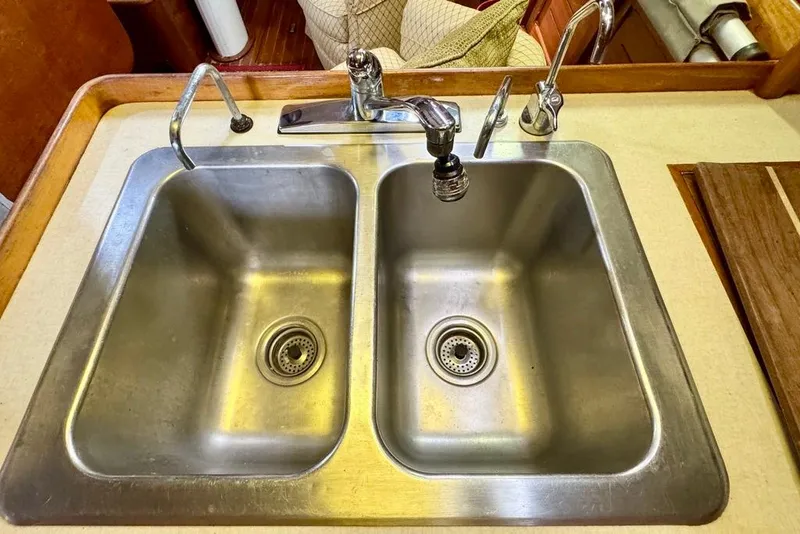 Slide: The Image of Stainless steel double sink in 1981 Bristol 45.5 Aft Cockpit yacht kitchen. - 27