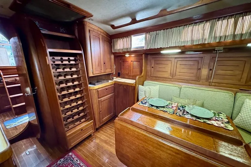 Slide: The Image of Interior of 1981 Bristol 45.5 Aft Cockpit yacht with wood finish and dining area. - 30