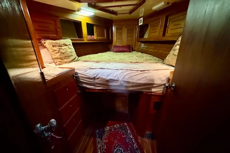Slide: The Image of Cozy cabin interior of 1981 Bristol 45.5 Aft Cockpit sailboat with wooden furnishings. - 39