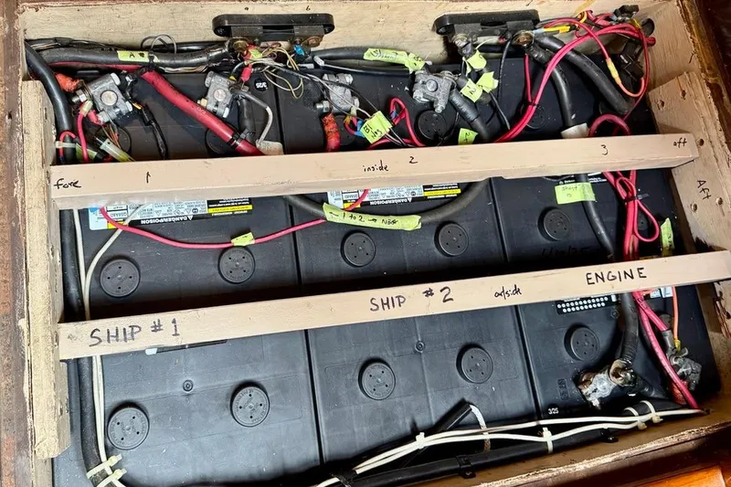 Slide: The Image of Battery compartment of 1981 Bristol 45.5 Aft Cockpit with labeled wiring and connections. - 45