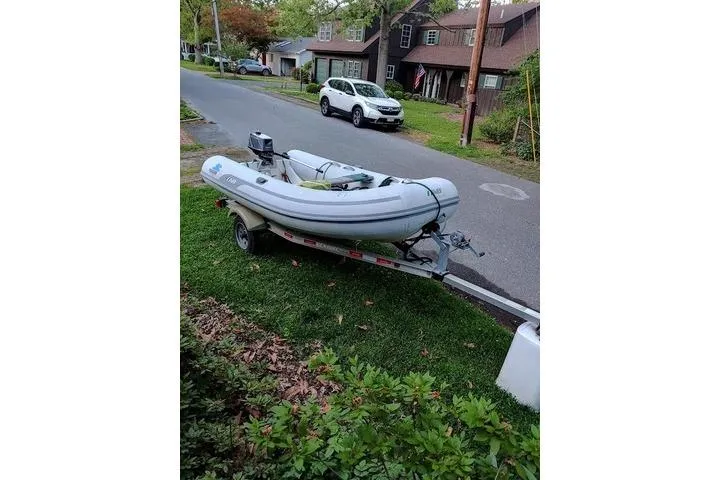 Slide: The Image of 1981 Bristol 45.5 Aft Cockpit boat on trailer, parked on suburban street. - 46