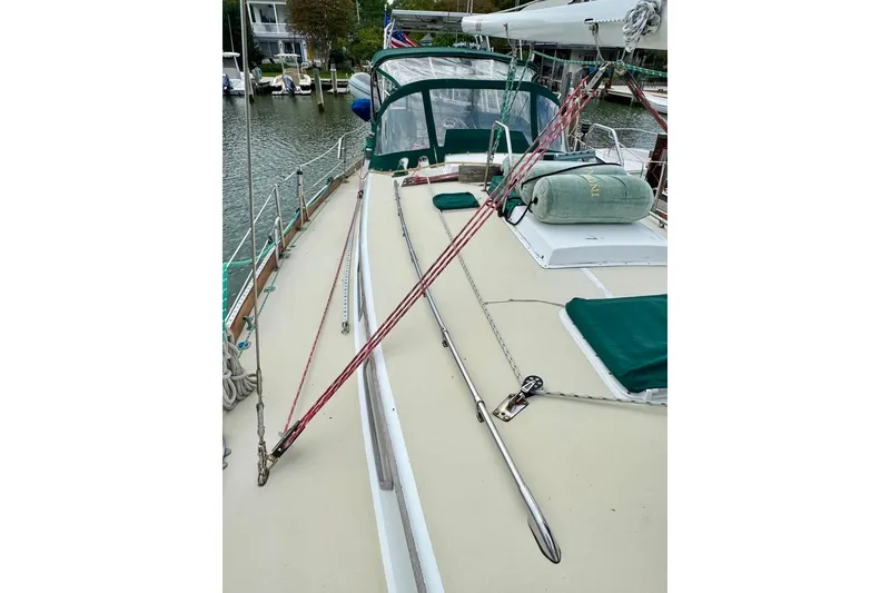 Slide: The Image of 1981 Bristol 45.5 Aft Cockpit sailboat deck with green covers and rigging. - 8
