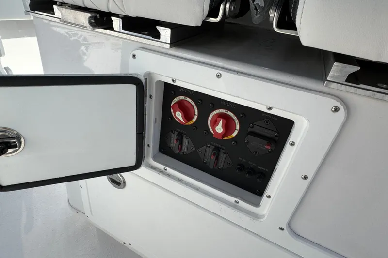 Slide: The Image of Control panel of 2026 Stingray 253 CC boat with open access door. - 13