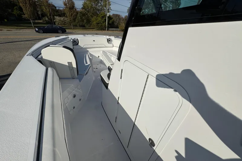 Slide: The Image of 2026 Stingray 253 CC boat interior with seating and storage compartments. - 18