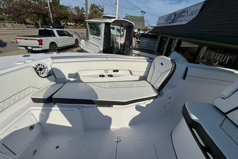 Slide: The Image of 2026 Stingray 253 CC boat interior with seating and speaker system. - 21