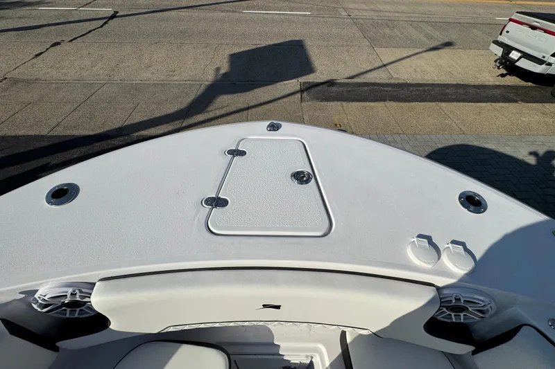 Slide: The Image of Bow of 2026 Stingray 253 CC boat with storage hatch and speakers. - 26