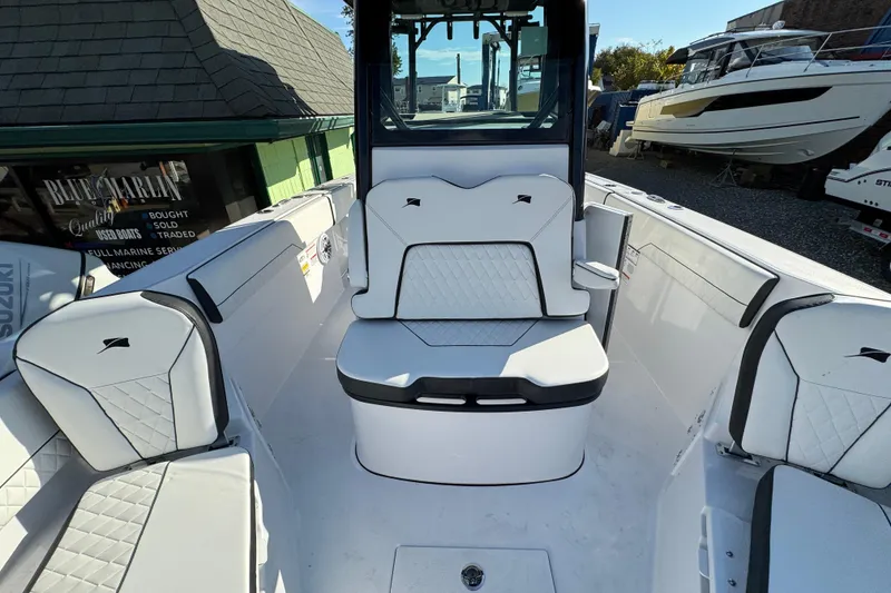 Slide: The Image of 2026 Stingray 253 CC boat interior with white seating and modern design. - 27