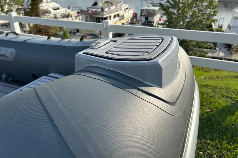 Slide: The Image of 2024 Highfield Classic 310 inflatable boat detail with marina background. - 5
