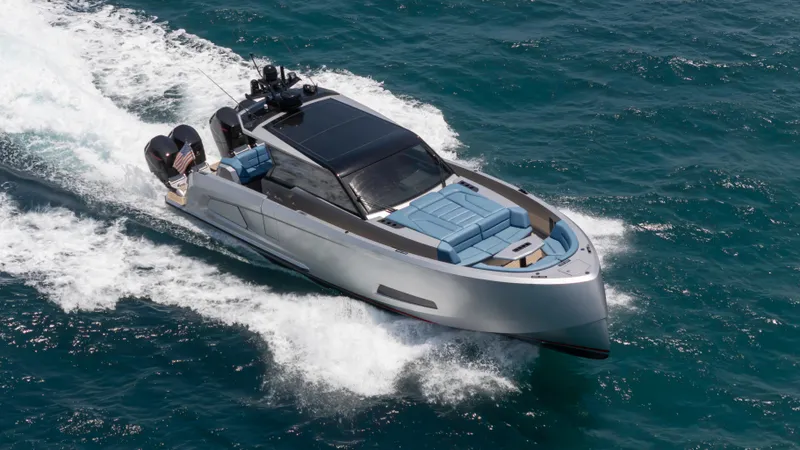 Slide: The Image of 2023 Vanquish Yachts VQ45 cruising on open water, showcasing sleek design and luxury features. - 12