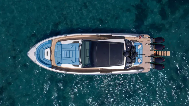Slide: The Image of Top view of 2023 Vanquish Yachts VQ45 on clear blue water. - 13