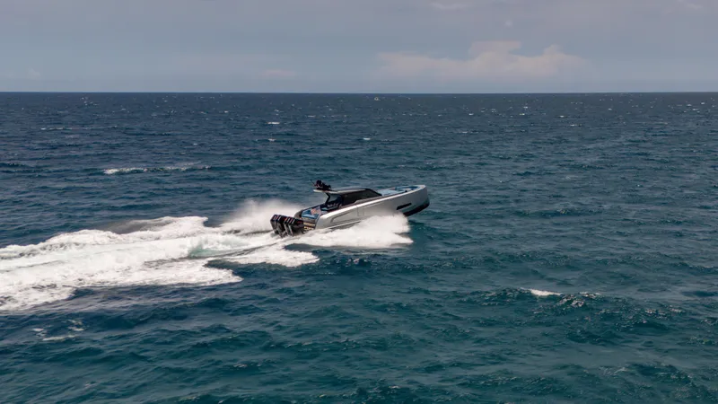 Slide: The Image of 2023 Vanquish Yachts VQ45 cruising swiftly on open ocean waters. - 14