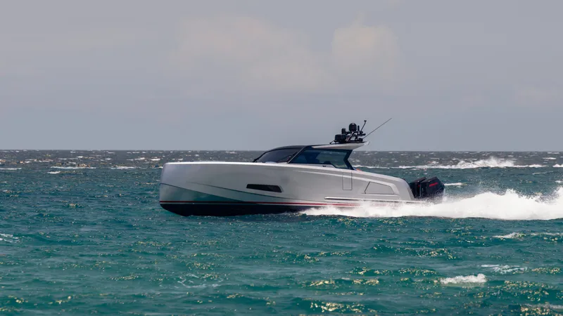 Slide: The Image of 2023 Vanquish Yachts VQ45 cruising on open water. - 2