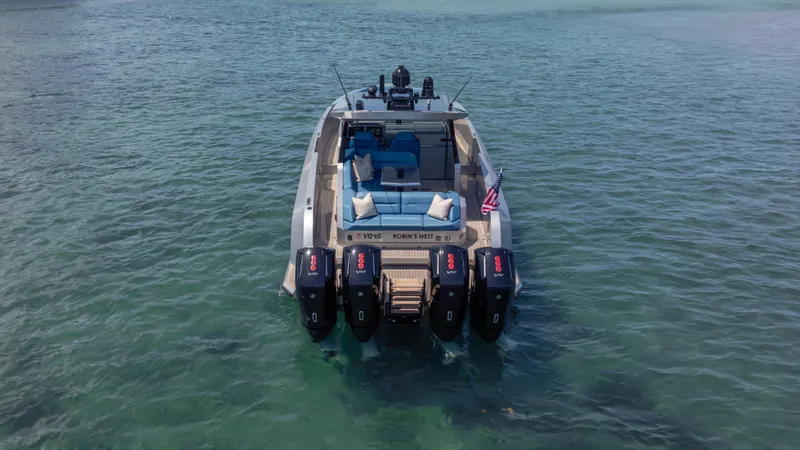 Slide: The Image of 2023 Vanquish Yachts VQ45 with multiple outboard engines on clear water. - 20