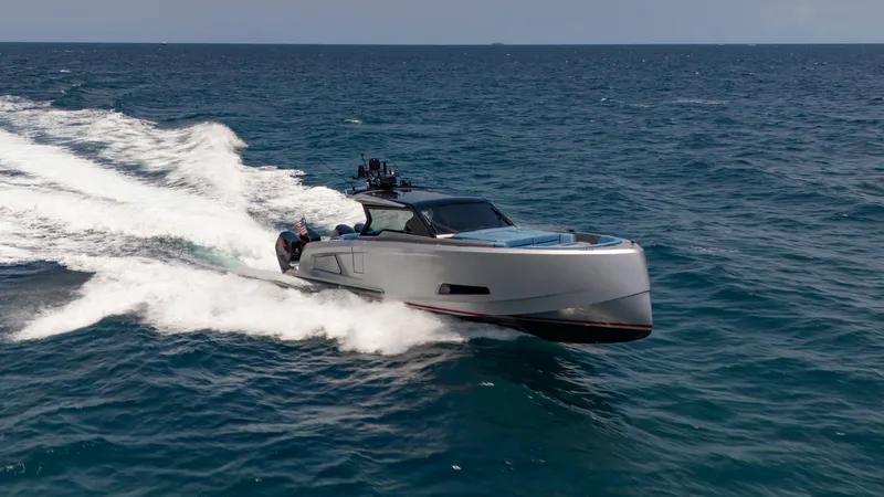 Slide: The Image of 2023 Vanquish Yachts VQ45 cruising swiftly on open ocean waters. - 3