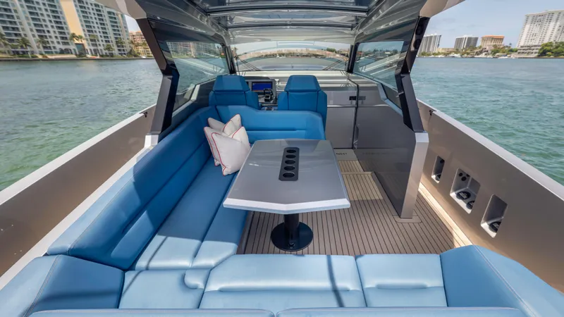 Slide: The Image of Luxurious 2023 Vanquish Yachts VQ45 interior with blue seating and scenic water view. - 39