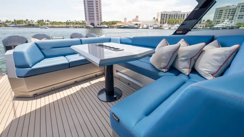 Slide: The Image of Luxurious 2023 Vanquish Yachts VQ45 interior with blue seating and elegant table. - 42